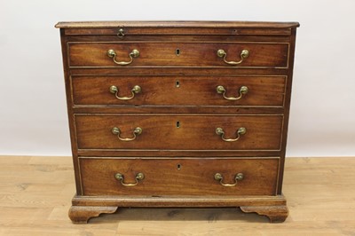 Lot 1445 - George II mahogany dressing chest of small size, with crossbanded top over brushing slide and four graduated drawers, each with brass swan neck handles on ogee bracket feet, 82cm wide x 48cm deep x...