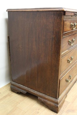 Lot 1445 - George II mahogany dressing chest of small size, with crossbanded top over brushing slide and four graduated drawers, each with brass swan neck handles on ogee bracket feet, 82cm wide x 48cm deep x...