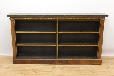 Lot 1444 - 19th century rosewood dwarf open bookcase, with painted top and applied carved gilt frieze, fixed open shelves on plinth base, 181cm long x 28cm deep x 94cm high