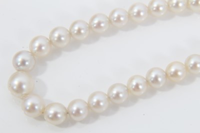 Lot 516 - Cultured pearl necklace with a string of graduated cultured pearls measuring approximately 5.5mm to 3.5mm on a good quality 14ct (585) gold and diamond clasp. Length approximately 45cm. In an assoc...