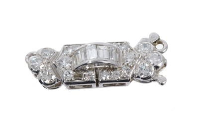 Lot 524 - Art Deco diamond clasp with baguette cut and single cut diamonds, in white gold setting, approximately 18mm.