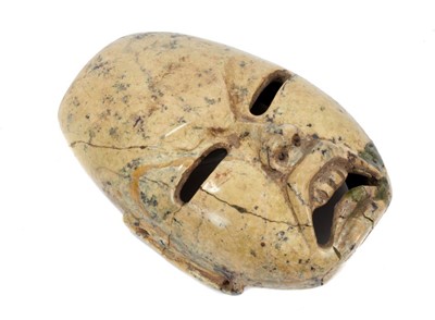 Lot 898 - Ancient Pre-Colombian Olmec stone human mask with frowning expression and exposed teeth , the long ears pierced and with two side mounting holes ,15 cm high, 10.5 cm wide Provenance : Formerly the...