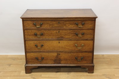 Lot 1389 - Mid 18th century oak chest of four long graduated drawers on bracket feet