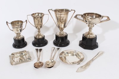 Lot 372 - George V silver two handled trophy cup of tapered form, with engraved presentation inscription, (Birmingham 1933) together with three other silver trophy cups, two silver ashtrays, four silver spoo...