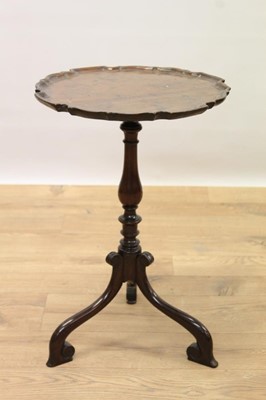 Lot 1406 - Small mahogany occasional table, with dished pie crust top on turned column and scrolling tripod supports,32cm diameter