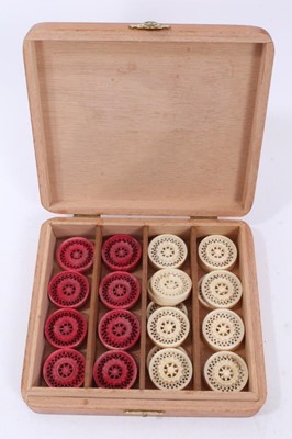 Lot 871 - Set 19th century Indian or Chinese export red stained and natural carved ivory backgammon or draughts pieces- set of 32 pieces , probably made for the Middle Eastern Market for Turkish draughts or...