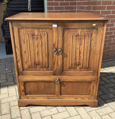 Lot 192 - Old Charm style oak cupboard/television cabinet