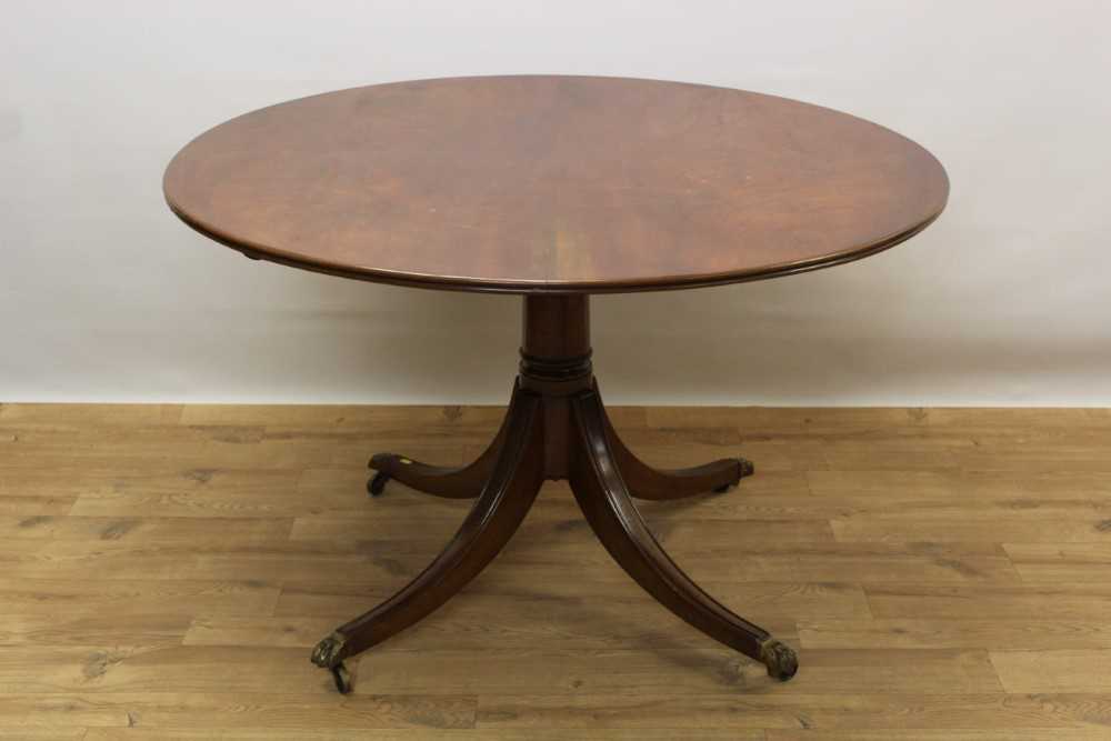 Lot 1354 - George III style mahogany circular pedestal dining table