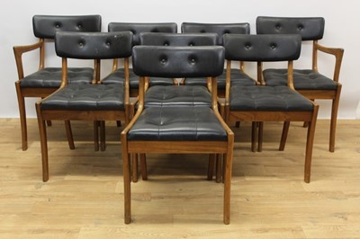 Lot 1373 - Set of six 1960s / 70s teak dining chairs, each with button upholstery on sabre legs