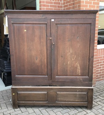 Lot 156 - Antique panelled oak cupboard enclosed by two panelled doors on base