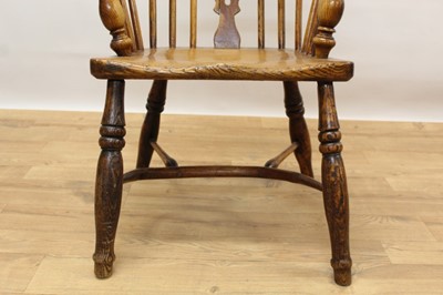 Lot 402 - 19th century ash and elm Windsor chair, with pierced vase splat and stick back, saddle seat on turned logs and crinoline stretcher