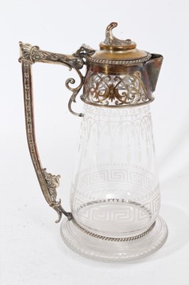 Lot 394 - Victorian glass claret jug of bulbous tapered form, with etched Greek key decoration, silver plated mount with pierced and engraved scroll decoration and hinged cover, 24.5cm overall height