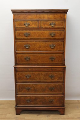 Lot 1398 - Good quality reproduction burr elm and inlaid chest on chest, with dentil moulded cornice, the upper section with two short over three long graduated drawers, the base with brushing slide and three...