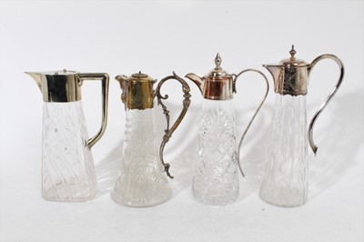 Lot 398 - Victorian cut glass claret jug of tapered form, with oval cut decoration and star cut base, silver plated mount with engraved inscription and hinged cover, 31cm overall height, together with three...