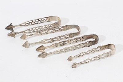 Lot 407 - Pair of Georgian silver sugar tongs with pierced decoration together with three other similar pairs (all with no date letters) and a pair of similar Edwardian silver sugar tongs (London 1904), all...