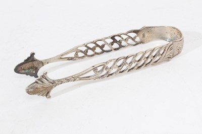 Lot 407 - Pair of Georgian silver sugar tongs with pierced decoration together with three other similar pairs (all with no date letters) and a pair of similar Edwardian silver sugar tongs (London 1904), all...