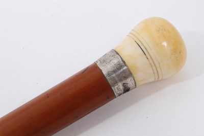 Lot 889 - Victorian Malacca gadget walking stick, with silver collar (London 1884) and hollow threaded Ivory knop handle, containing a set of dice and a separate set of miniature dominoes
