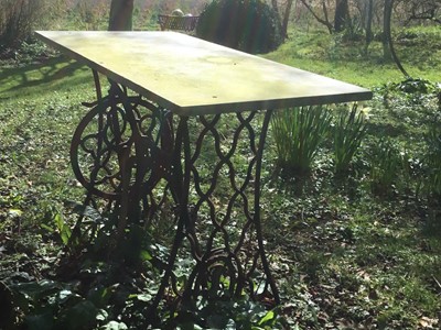 Lot 1859 - Early 20th century cast iron garden table utilising a Singer sewing machine base with rectangular white marble top, 91cm wide