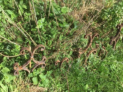 Lot 1868 - Approximately sixty wrought iron elements of scroll design, formally used as garden edging, 38cm high