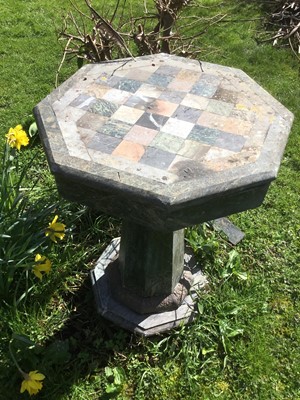 Lot 1869 - Specimen marble table with octagonal chequer board top, on tapered octagonal column and base, 50cm diameter