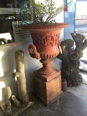 Lot 1340 - Large classical campana shape garden urn with egg and dart border, scroll frieze and two handles on pedestal base and square plinth.