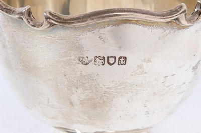 Lot 429 - George V silver bowl with monteith style border, on circular pedestal foot, (London 1918), maker Goldsmiths & Silversmiths Company, all at 7oz, 10cm in overall height