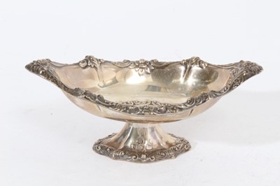 Lot 435 - Victorian silver bonbon dish of navette form with embossed decoration (Birmingham 1895), together with two graduated Victorian silver Quaiches with pierced decoration (London 1893), maker William C...