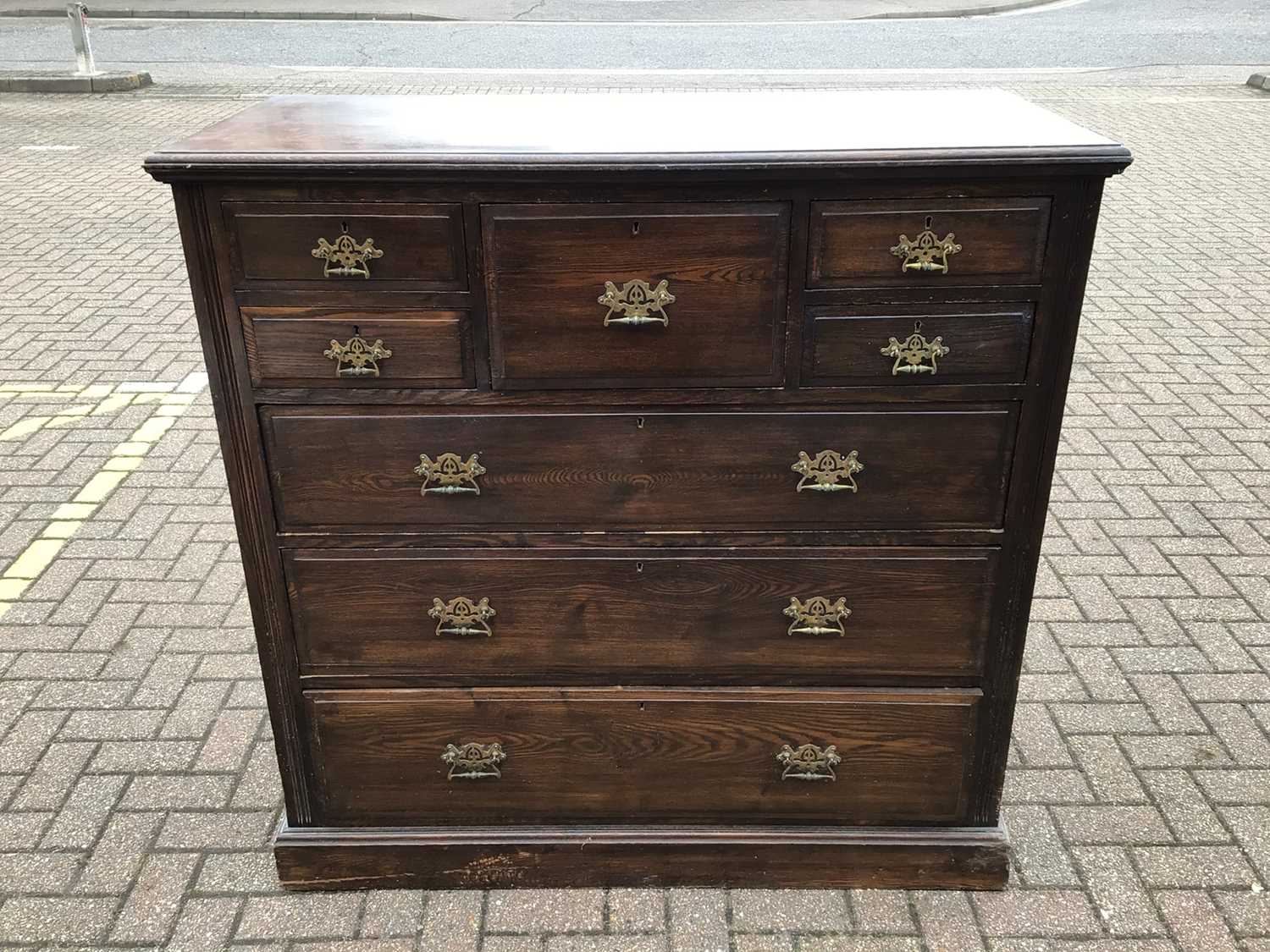 Lot 212 - Edwardian oak chest with central hat drawer flanked by four short drawers and three long graduated drawers below, 122cm wide, 53cm deep, 121cm high