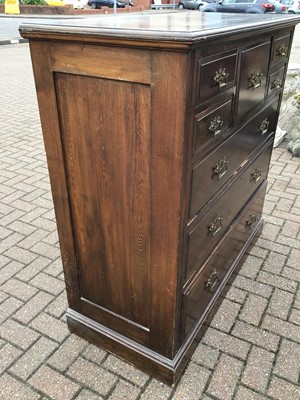 Lot 212 - Edwardian oak chest with central hat drawer flanked by four short drawers and three long graduated drawers below, 122cm wide, 53cm deep, 121cm high