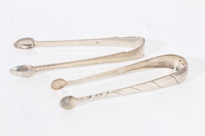 Lot 503 - Pair of George III Irish silver sugar tongs, and a pair of Scottish Provincial silver sugar tongs