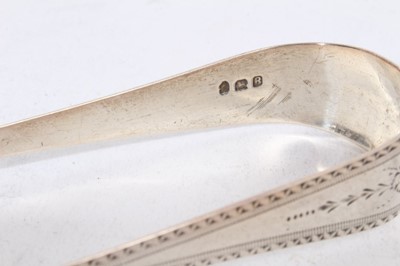 Lot 303 - 5 pairs of George III silver sugar tongs, with bright cut engraved decoration, London circa.