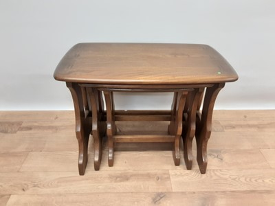 Lot 241 - Nest of three Ercol elm tables, largest is 57cm wide, 35cm deep, 42cm high
