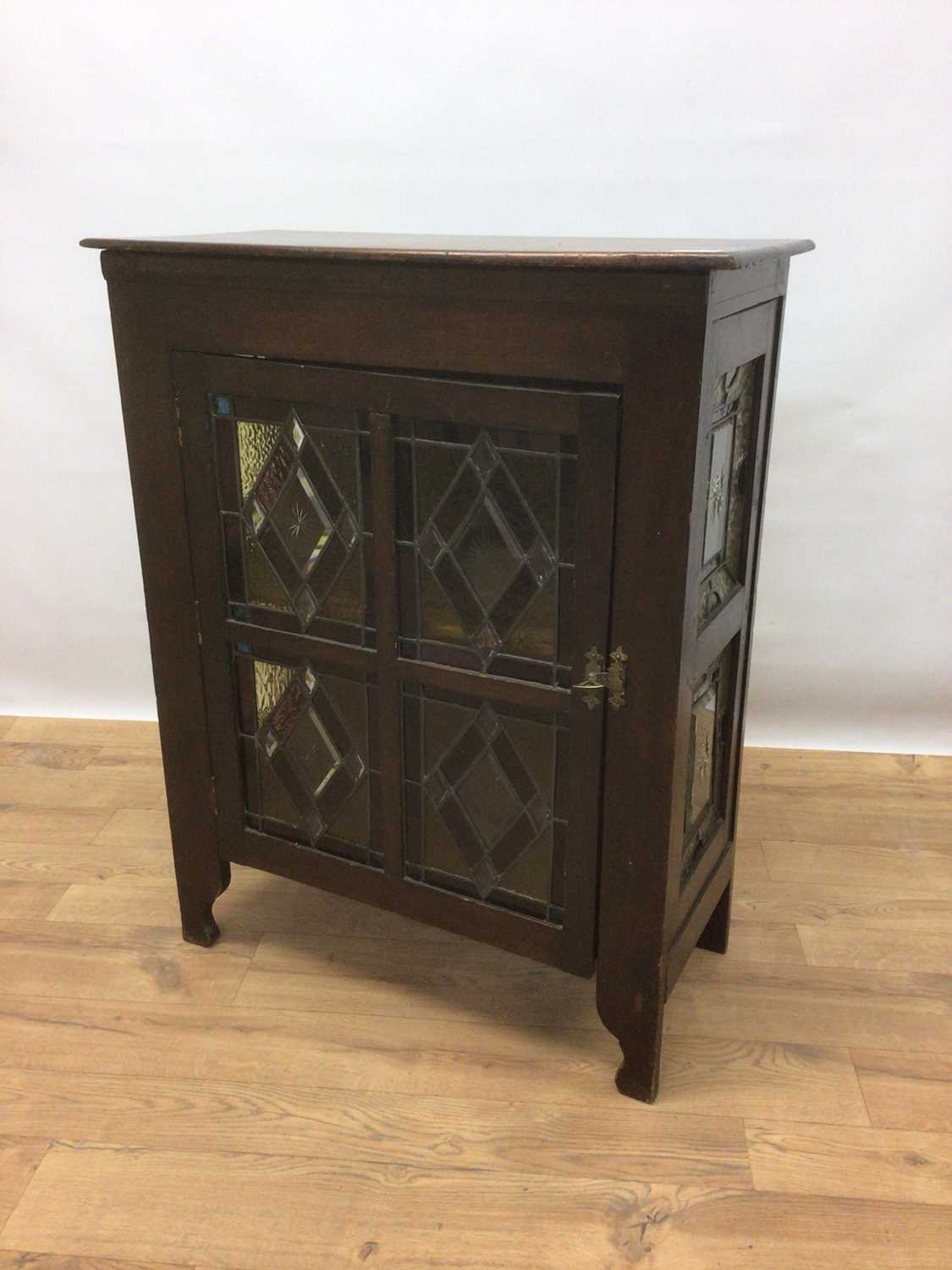 Lot 107 - Early 20th century cabinet with shelved interior enclosed by stained and leaded glazed door, 68cm wide, 32cm deep, 86cm high