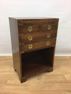 Lot 274 - Mahogany military style brass bound bedside table with brushing slide, four drawers and recess below, 45.5cm wide, 30.5cm deep, 69.5cm high