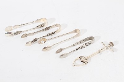 Lot 518 - Pair of Edwardian silver claw action sugar / olive tongs, (Birmingham 1908) and others