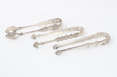 Lot 309 - Pair of George III silver sugar tongs with engraved decoration, (London 1782), 12.5cm overall, together with another two pairs of silver sugar tongs, (various dates and makers) (3)