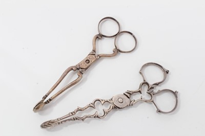 Lot 312 - Pair of George III silver scissor action sugar nips, circa. 1760, 11cm overall, together with another pair of Georgian silver scissor action sugar nips, (marks rubbed) (2)