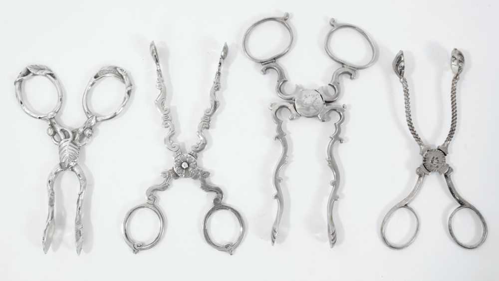 Lot 314 - Pair of good quality Victorian silver scissor action sugar nips of naturalistic form, (London 1859), Francis Higgins, 10cm overall, together with another three pairs of silver scissor action sugar...