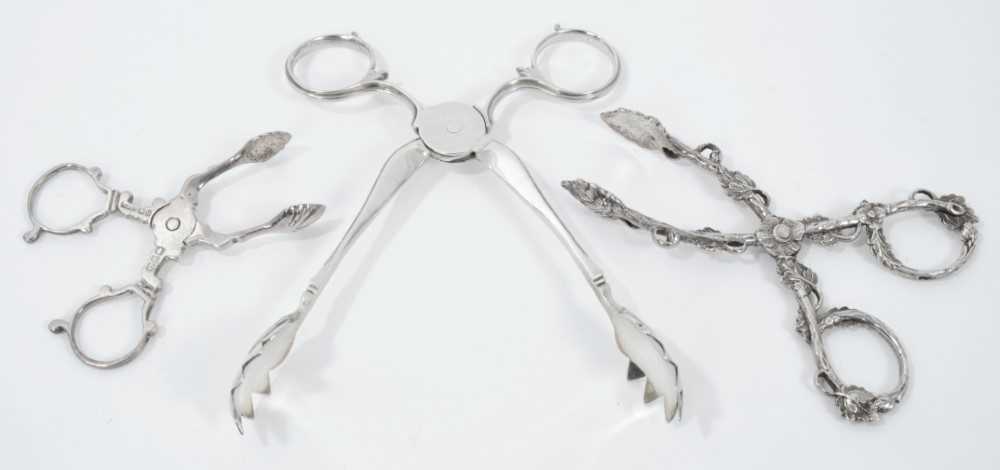 Lot 315 - Pair of Victorian silver scissor action ice tongs, (London 1857), maker F. Higgins, 14.5cm overall, together with two pairs of  silver scissor action sugar nips, (various dates and makers) (3)