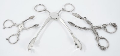 Lot 315 - Pair of Victorian silver scissor action ice tongs, (London 1857), maker F. Higgins, 14.5cm overall, together with two pairs of  silver scissor action sugar nips, (various dates and makers) (3)