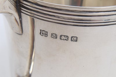 Lot 341 - Victorian silver christening mug of cylindrical form with embossed scroll decoration and one other