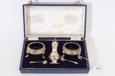 Lot 473 - George II silver caster and pair George III salts in an associated case.