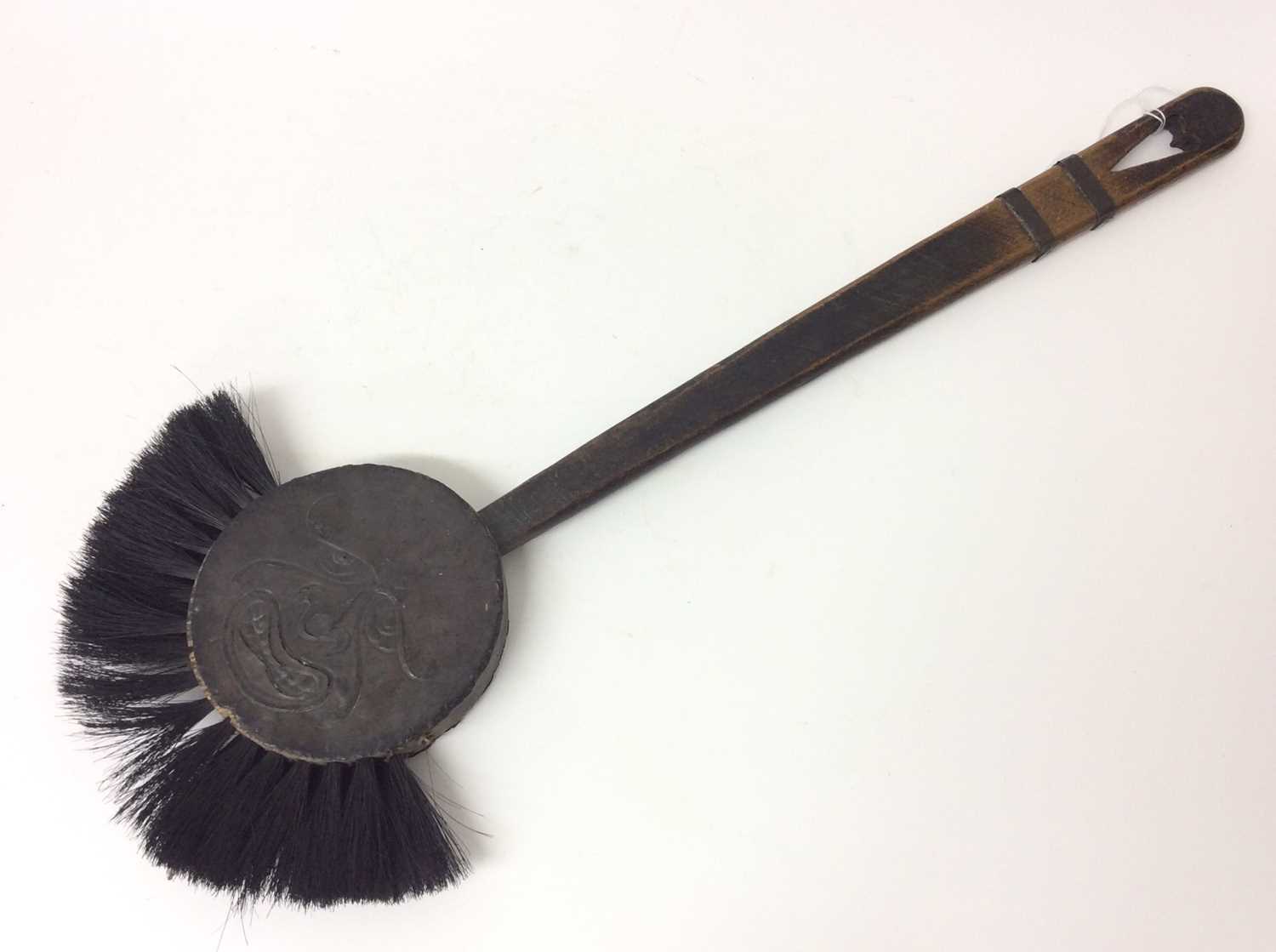 Lot 953 - Arts & Crafts Inglenook Fireplace brush in the form of the man in the moon