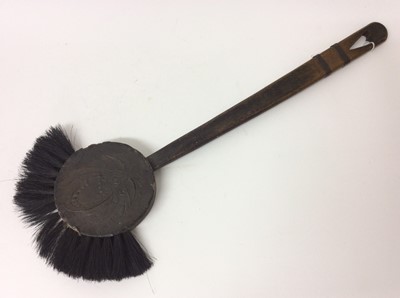 Lot 953 - Arts & Crafts Inglenook Fireplace brush in the form of the man in the moon