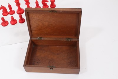 Lot 881 - Antique bone and red stained bone chess set in associated brass and mother of pearl inlaid box