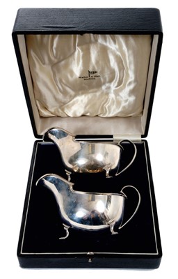 Lot 392 - Pair of Art Deco silver sauce boats, set of six silver coffee spoons and a silver ladle