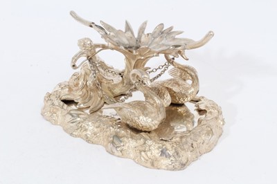 Lot 436 - Victorian silver plated table centrepiece modelled as a putto with two Swans.