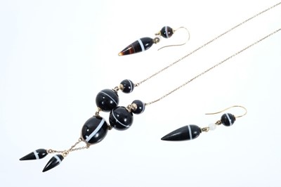 Lot 554 - Victorian banded agate necklace and earrings, the necklace the graduated banded agate spheres and oval cabochon suspending torpedo shape drops together with a pair of matching earrings en-suite.