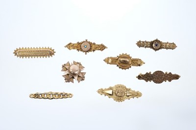 Lot 557 - Eight Victorian gold brooches to include Etruscan Revival