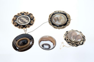 Lot 568 - Five brooches to include two early Victorian seed pearl and black enamel mourning brooches